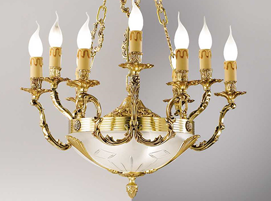 The elegance and unique style of an antique brass and crystal chandelier